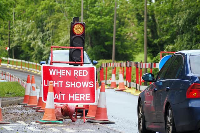 A car stopped behind temporary traffic lights on Chesterfield Road in Brimington.