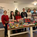 Members of Lubrizol's charities and communities committee with their toy collection