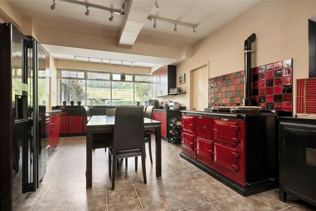 The breakfast kitchen features a generous range of base cabinetry, with a four oven Aga. The kitchen is supported by a utility room, spacious pantry, store, and laundry room with a door out to the walled courtyard.
