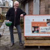 Peter Milner, Derbyshire Historic Buildings Trust lead trustee for the restoration project, and Lucy Godfrey, project co-ordinator, with an information board outside the station.