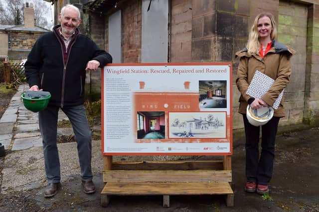 Peter Milner, Derbyshire Historic Buildings Trust lead trustee for the restoration project, and Lucy Godfrey, project co-ordinator, with an information board outside the station.