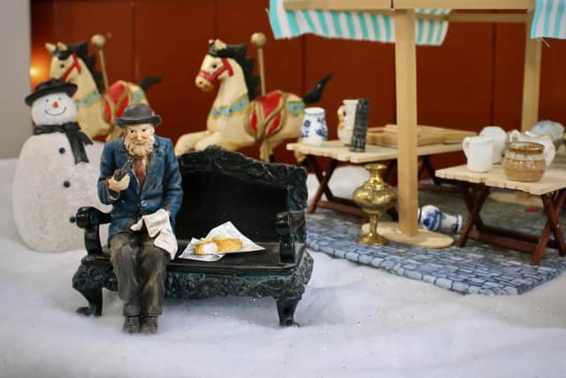 A miniature old man with fish n chips