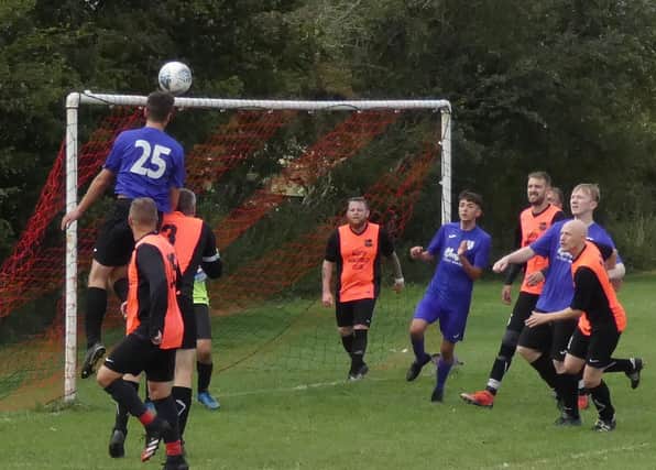 Joe Whittaker rises to head home the only goal of the game as Espial beat North Wingfield in Division Five. Pic by Martin Roberts.