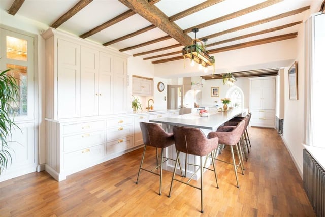 The open-plan kitchen is large enough to accommodate a table and chairs.