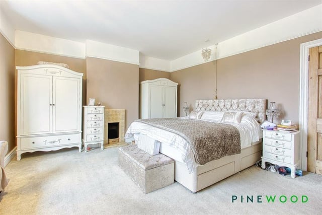This fantastic sized double bedroom overlooks the rear garden. A fireplace and painted decor with coving are among its features.