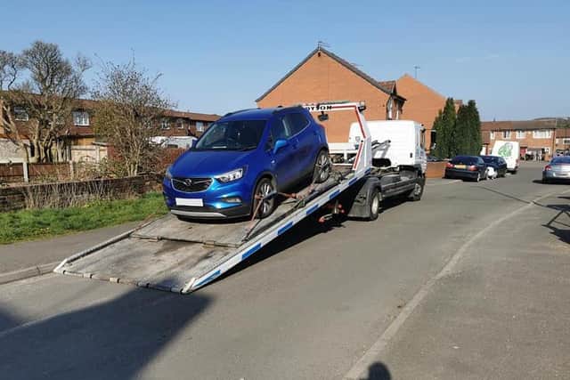 Police officers have seized a car from outside a north Derbyshire home. Image: Derbyshire police.