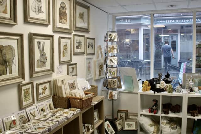 Artwork, cushions and cuddly toys inside Delightful Decor, Chesterfield