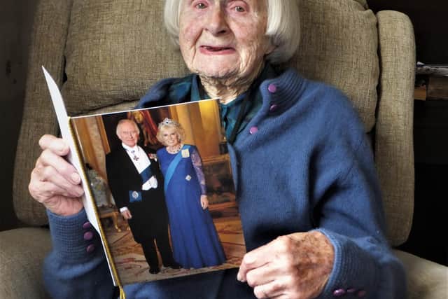 Dorothy Ash with her birthday card from the King and Queen.