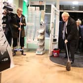 Britain's Prime Minister Boris Johnson poses in a flood-stricken Matlock opticians in 2019. (Photo by Danny Laswon/POOL/AFP via Getty Images)