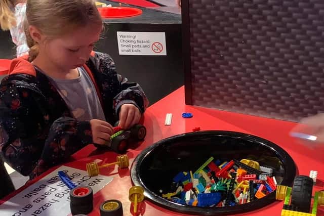 Visitors can have a go at making their own Lego racing car.