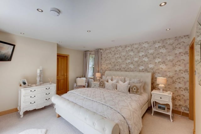 The Master Suite is found on the first floor and has doors to the left and right of the bed for the dressing room and ensuite, with a large door leading onto the private balcony overlooking the expansive garden.