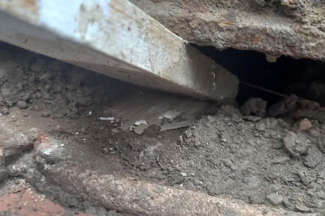 This photo shows the black mortar in-between brickwork crumbled into dust