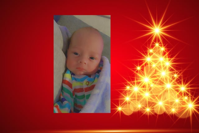 At five weeks old, Thomas is ready for his first Christmas.