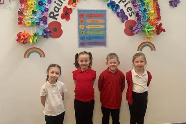 Pupils Esme-Eliza, Libby, Jacob and Izzy with Sharley Park Community Primary School's colourful artwork.