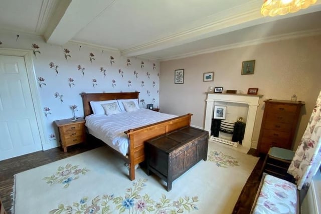 The bedrooms, two of which have en suite shower rooms, are arranged over the upper two floors of the house.