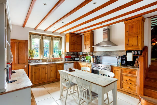 The pine farmhouse style kitchen has granite worksurfaces. Integral appliances include a dishwasher, electric range style oven with five ring hob and extractor above. An inner hall  from the kitchen leads on to a wc, utility room and  walk-in pantry.