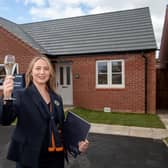 Sales advisor Molly outside the Tunstall  view home, which is open at Bellway’s Hatton Court development in Hatton