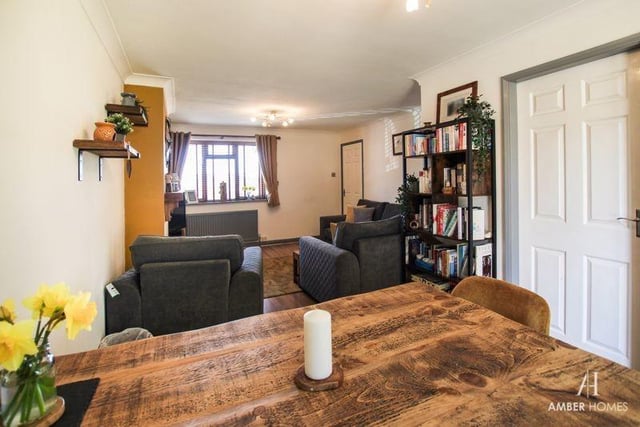 There is an abundance of space in the living room/diner, including for a dining table. The floor is laminated and there is a soft wood double-glazed window to the front of the property.