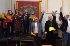 Members of the Women's Action Group and guests sing songs written for the miners' strike in 1984-85.