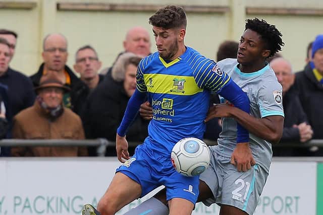 George Carline in action for Solihull Moors against Devante Rodney of Hartlepool United.