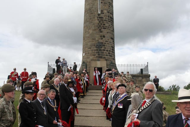 Dignataries line the steps to the memorial tower for the service.