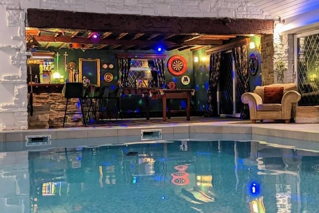 Dive into your own swimming pool and relax with a few drinks at the bar afterwards.