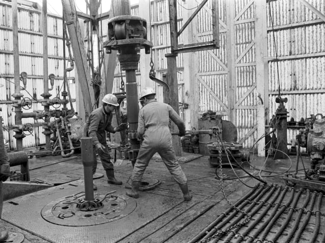 Men working on the drill on the Staflo oil rig in the North Sea, March 1971.