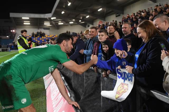 Joe Quigley pictured signing Josh's latest poster after the FA Cup win at AFC Wimbledon on Saturday. Image: Alex Broadway/Getty Images.