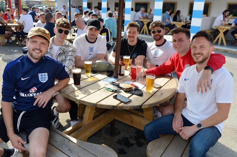Outdoor drinkers at the Spotted Frog, in Brampton, watch England's 2-0 Euro 2020 win over Germany in June last year.