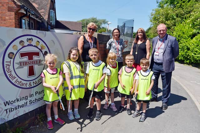 Tibshelf Infant and Nursery School pupils litter picking with headteacher Zoe Andrews, Kelly Perks, operations manager for Road Chef, Coun Deborah Watson cabinet member street services and environmental health at Bolsover Council and Rob Allen, site director for Tibshelf Road Chef.