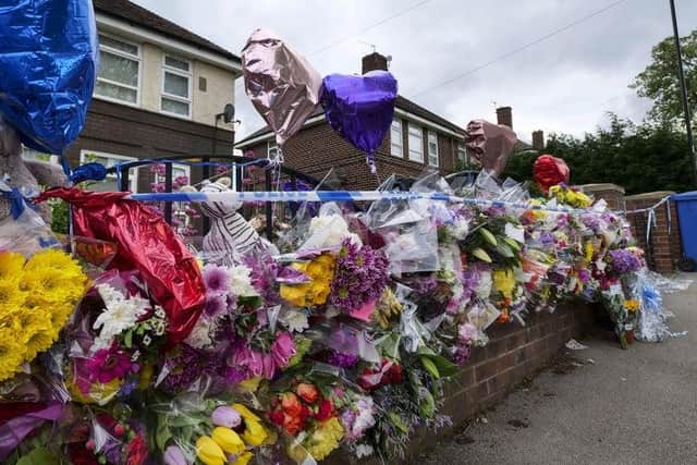 Flowers left outside the house in Shiregreen where Blake and Tristan Barrass were killed by their parents