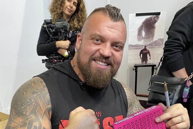 Former World’s Strongest Man Eddie Hall, sampling one of Project D’s protein doughnuts