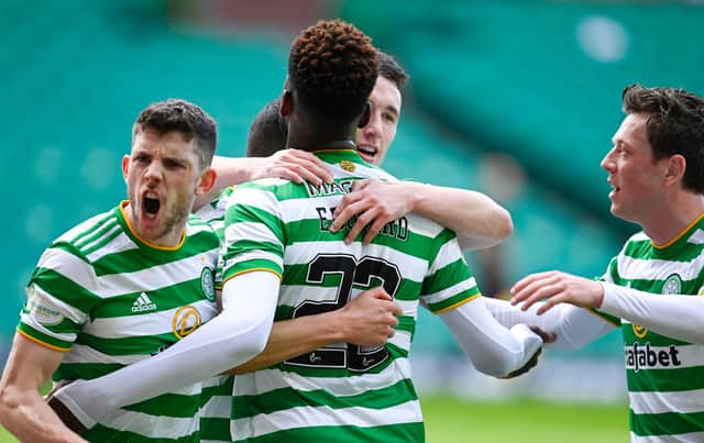 Celtic's Mohamed Elyounoussi celebrates making it 1-0 with his teammates during the Scottish Premiership match against Rangers at Celtic Park. (Photo by Rob Casey / SNS Group)