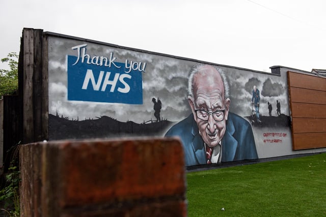 A mural that has been created to pay tribute to NHS fundraiser Captain Tom Moore outside Bradley Scott Windows in Tamworth, Staffordshire.