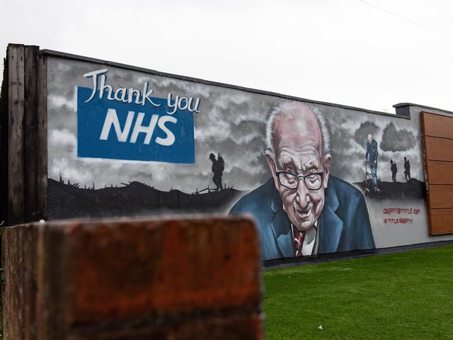 A mural that has been created to pay tribute to NHS fundraiser Captain Tom Moore outside Bradley Scott Windows in Tamworth, Staffordshire.