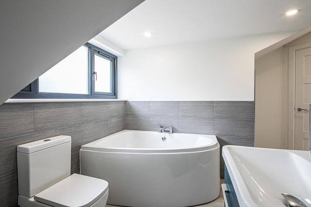 The corner bath possesses style and maximises the bathroom space.