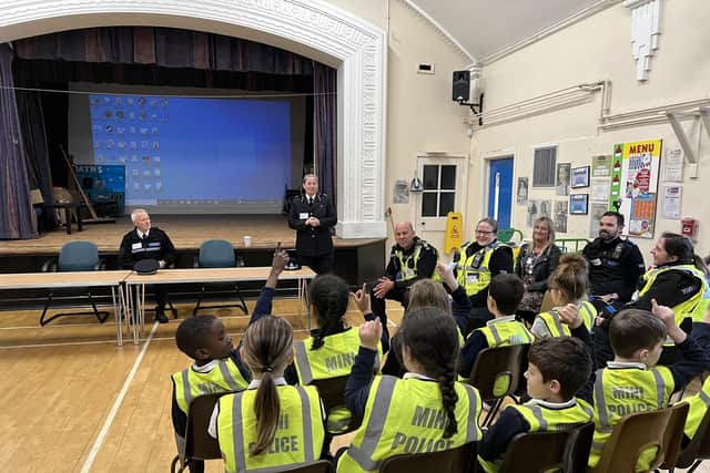 Judges were impressed by how Spire Junior School works within the community, such as being park of the mini police project. Pictured are Year 5 pupils with Derbyshire police Assistant Chief Constable Michelle Shooter
