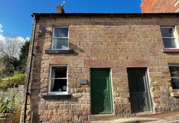 The cottage at Wash Green, Wirksworth is part of a terrace where there is on-street parking.