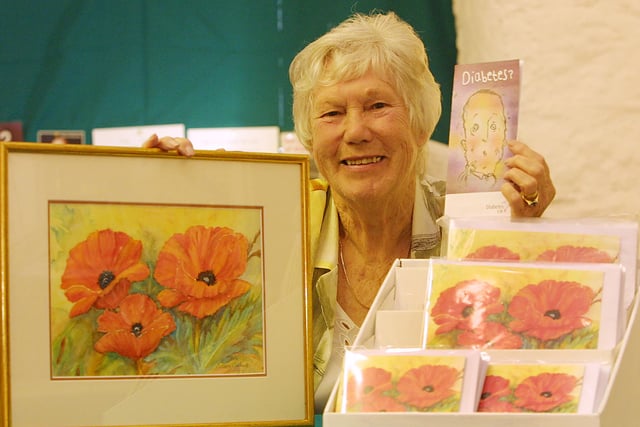 Artist Doreen Andrews with her painting of poppies which was exhibited at Cromford Mill and was reproduced in card form to raise money for Diabetes UK in 2006