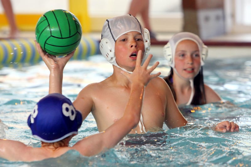 South Darley Primary School (blue) and Brassington Primary School (white) battle for the ball in a keenly fought semi-final during an annual inter-schools water polo tournament at Matlock Lido.