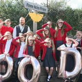 Executive headteacher David Ratcliffe celebrates with pupils at Penny Acres Primary.