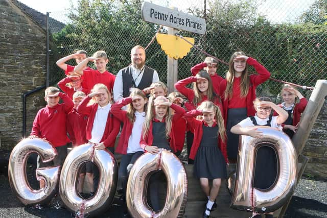 Executive headteacher David Ratcliffe celebrates with pupils at Penny Acres Primary.