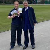 Club chairman Nigel Mallender, left, and Tim Murray on the Chesterfield ground with copies of Queen's Park Life.