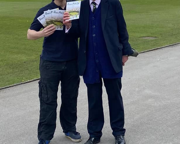 Club chairman Nigel Mallender, left, and Tim Murray on the Chesterfield ground with copies of Queen's Park Life.