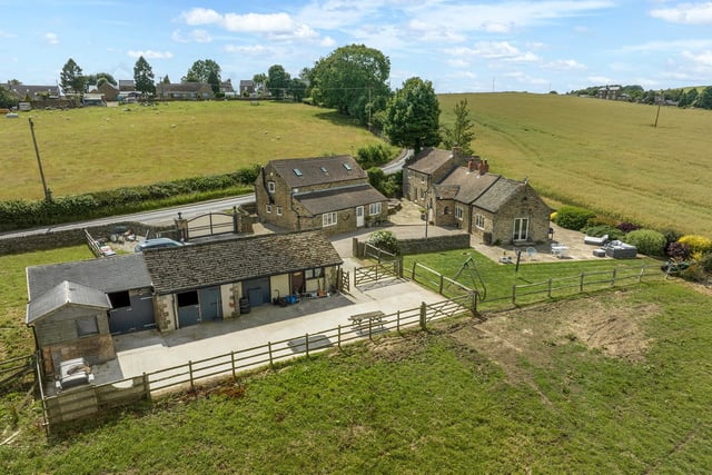Stables are close to grazing fields, making this a perfect property for a family with an equestrian interest.