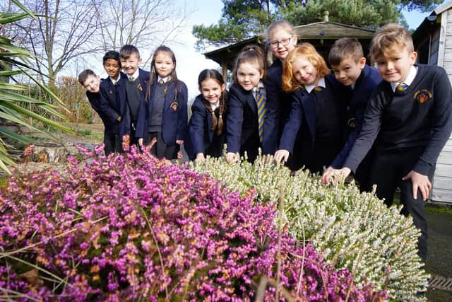 Year 3 and 4 pupils in the garden outdoor learning area used for 'Cavendish College' on a Friday afternoon