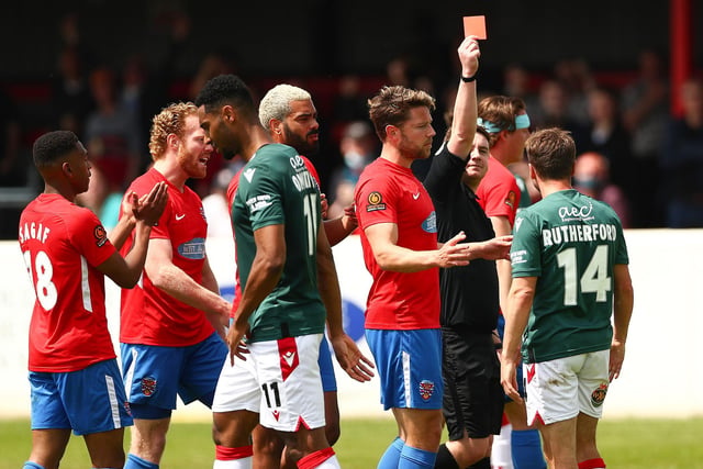 Paul Rutherford of Wrexham receiving a red card from match referee James Durkin during the Vanarama National League match between Dagenham and Redbridge and Wrexham. It was one of five red cards.
