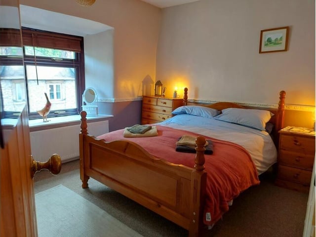 This large double bedroom has a built-in wardrobe.