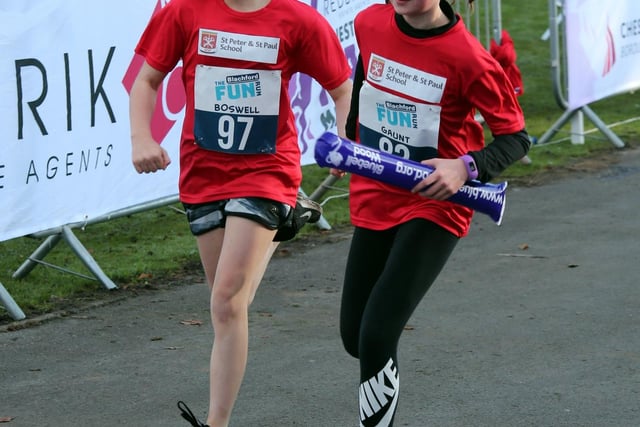 This duo are pictured crossing the finish line.