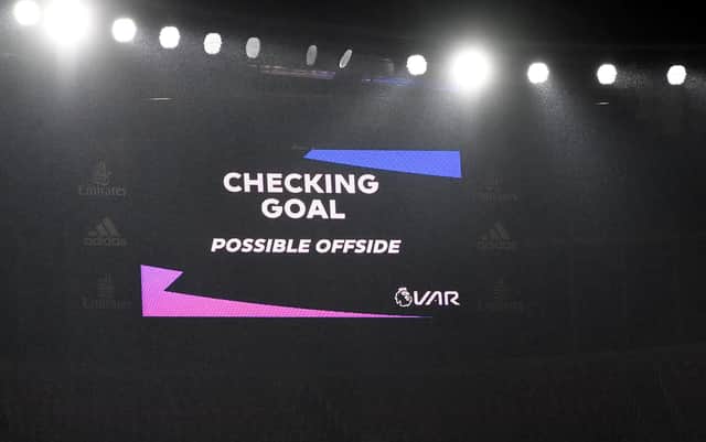LONDON, ENGLAND - NOVEMBER 08: A screen inside the stadium displays the decision to check VAR for offside after John McGinn scores his team's first goal during the Premier League match between Arsenal and Aston Villa
